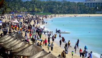 News zur Corona-Pandemie - Nach Corona-Ausbruch sitzen Zehntausende Touristen in „Chinas Hawaii“ fest