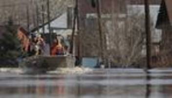russland: fast 12.000 häuser stehen nach dammbruch unter wasser