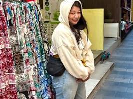 kältewelle überrollt bangkok: thailänder bibbern im wollpulli