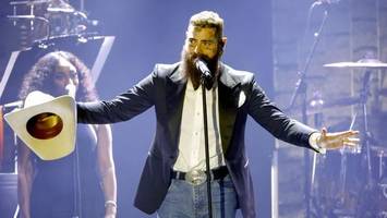 us-sänger post malone posiert gemeinsam mit deutschem schlagerstar
