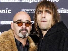 wir sehen dich in südamerika: oasis-gitarrist unterbricht tour wegen krebs
