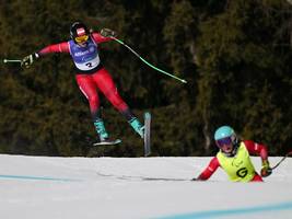begleitläufer bei den paralympics: der eine schaut, der andere fährt