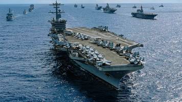 trump deutet 100 raketen auf wichtiges ziel an: rätsel um iran-angriff auf flugzeugträger uss abraham lincoln