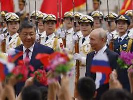Einigkeit in Peking demonstriert: Putin preist Beziehung - und verspricht Xi verlässliche Energielieferungen