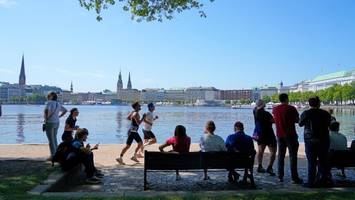 triathleten trotzen der hitze in hamburg – hsv-boss erhält verrückte pannenhilfe