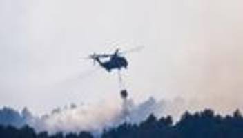 hoffen auf regen: brand in nationalpark - bundeswehr löscht mit hubschraubern